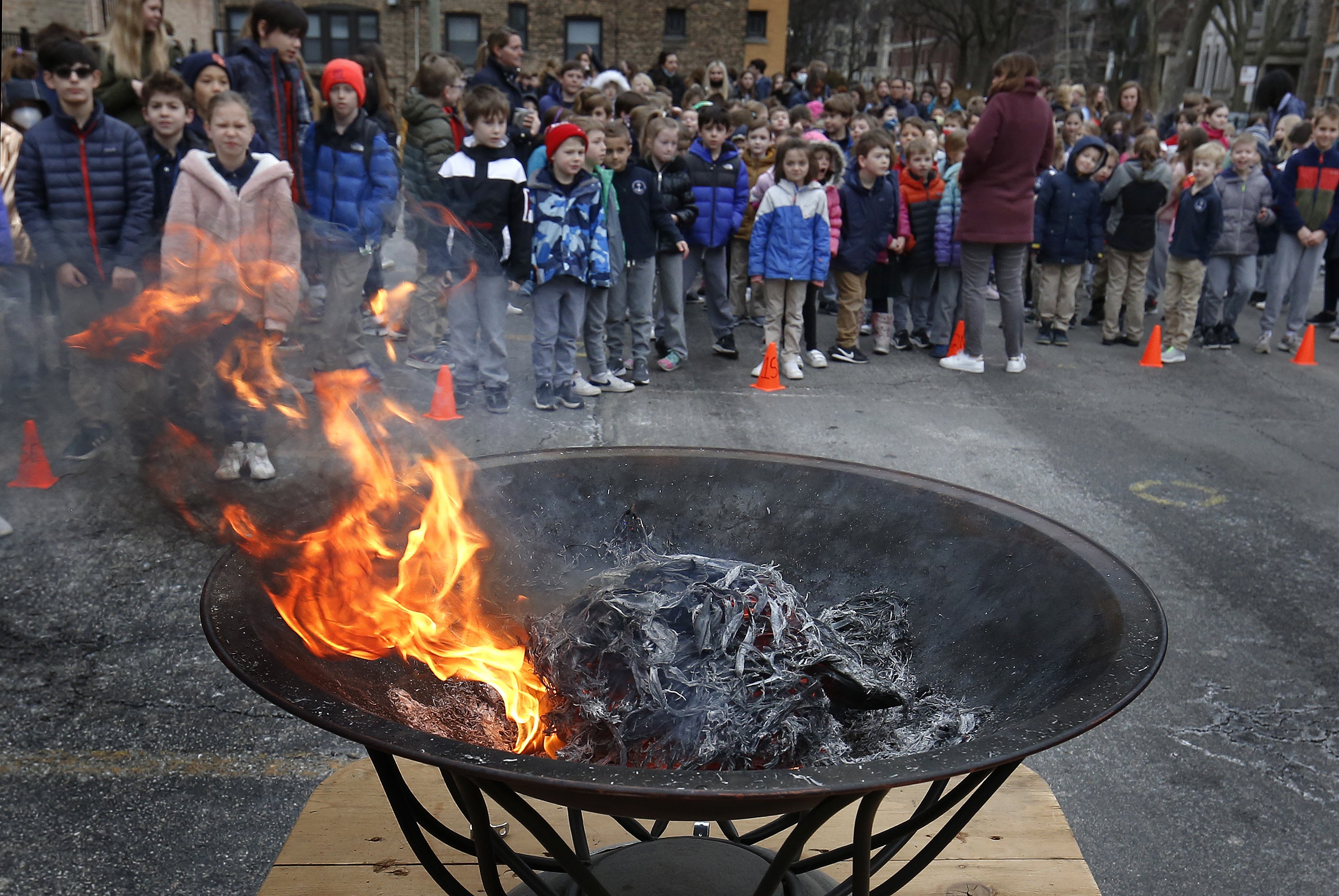 Palms burn at St. Clement School on Shrove Tuesday in Chicago March 1, 2022, during a prayer service for peace in the Ukraine. (CNS photo/Karen Callaway, Chicago Catholic
