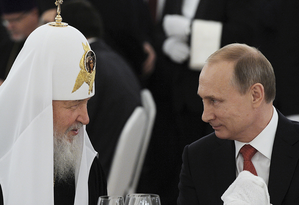Russian President Vladimir Putin, right, listens to Russian Orthodox Patriarch Kirill of Moscow during a reception at the Kremlin in Moscow in this July 28, 2015, file photo. (CNS) Russian President Vladimir Putin, right, listens to Russian Orthodox Patriarch Kirill of Moscow during a reception at the Kremlin in Moscow in this July 28, 2015, file photo. (CNS)