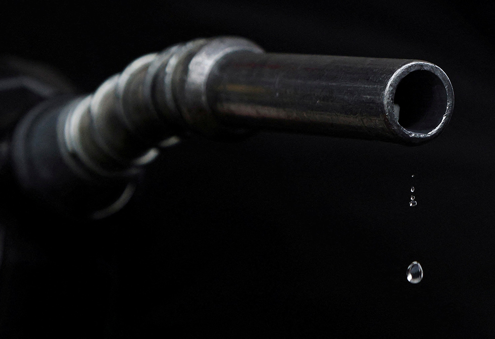Gasoline drips out of a nozzle March 7 in Somerville, Massachusetts. (CNS/Reuters/Brian Snyder) Gasoline drips out of a nozzle March 7 in Somerville, Massachusetts. (CNS/Reuters/Brian Snyder)