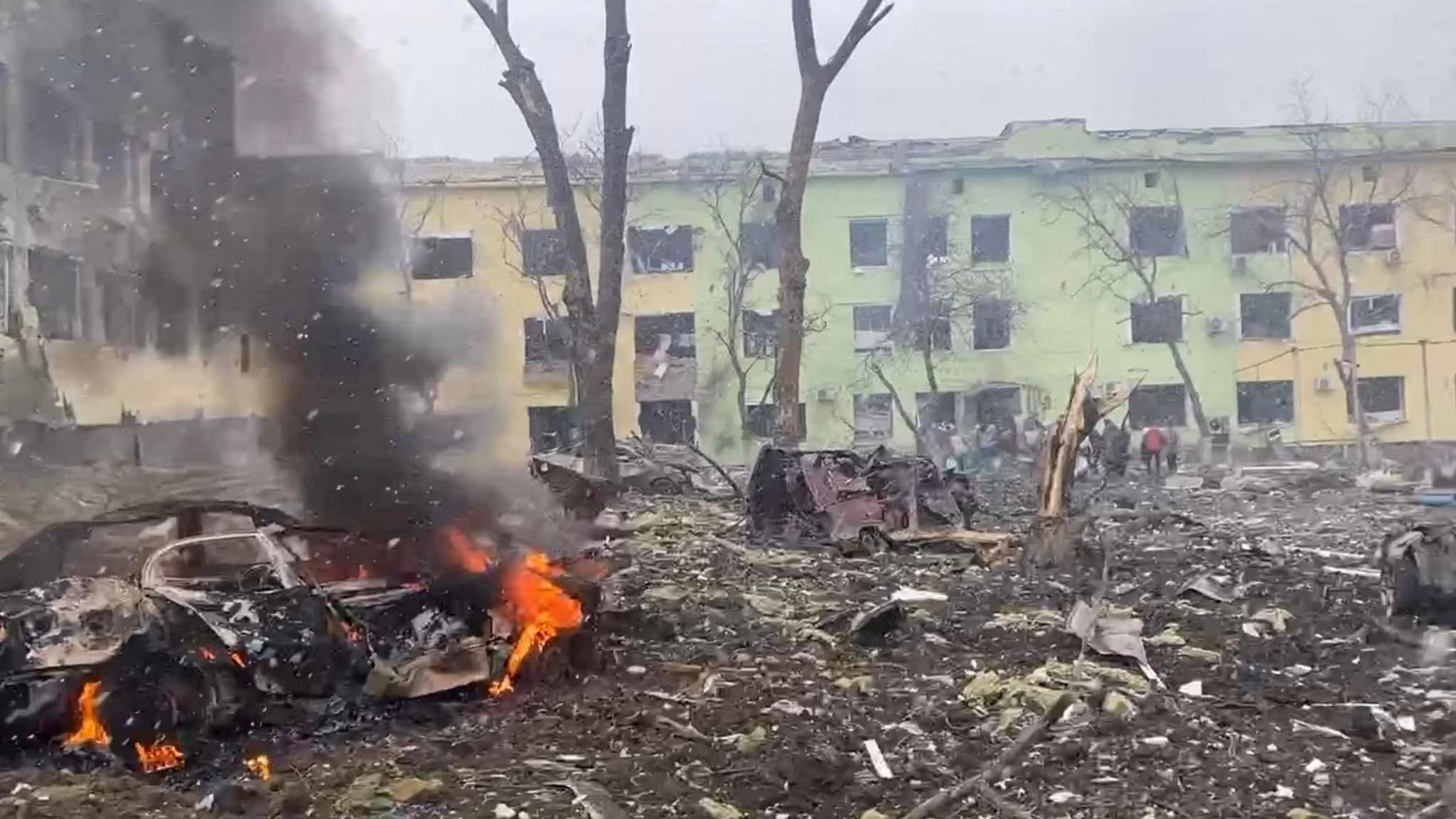 A view shows cars and a building of a hospital destroyed by an airstrike in Mariupol, Ukraine, in this handout picture released March 9, 2022. \(CNS photo/Press service of the National Police of Ukraine/handout via Reuters) 