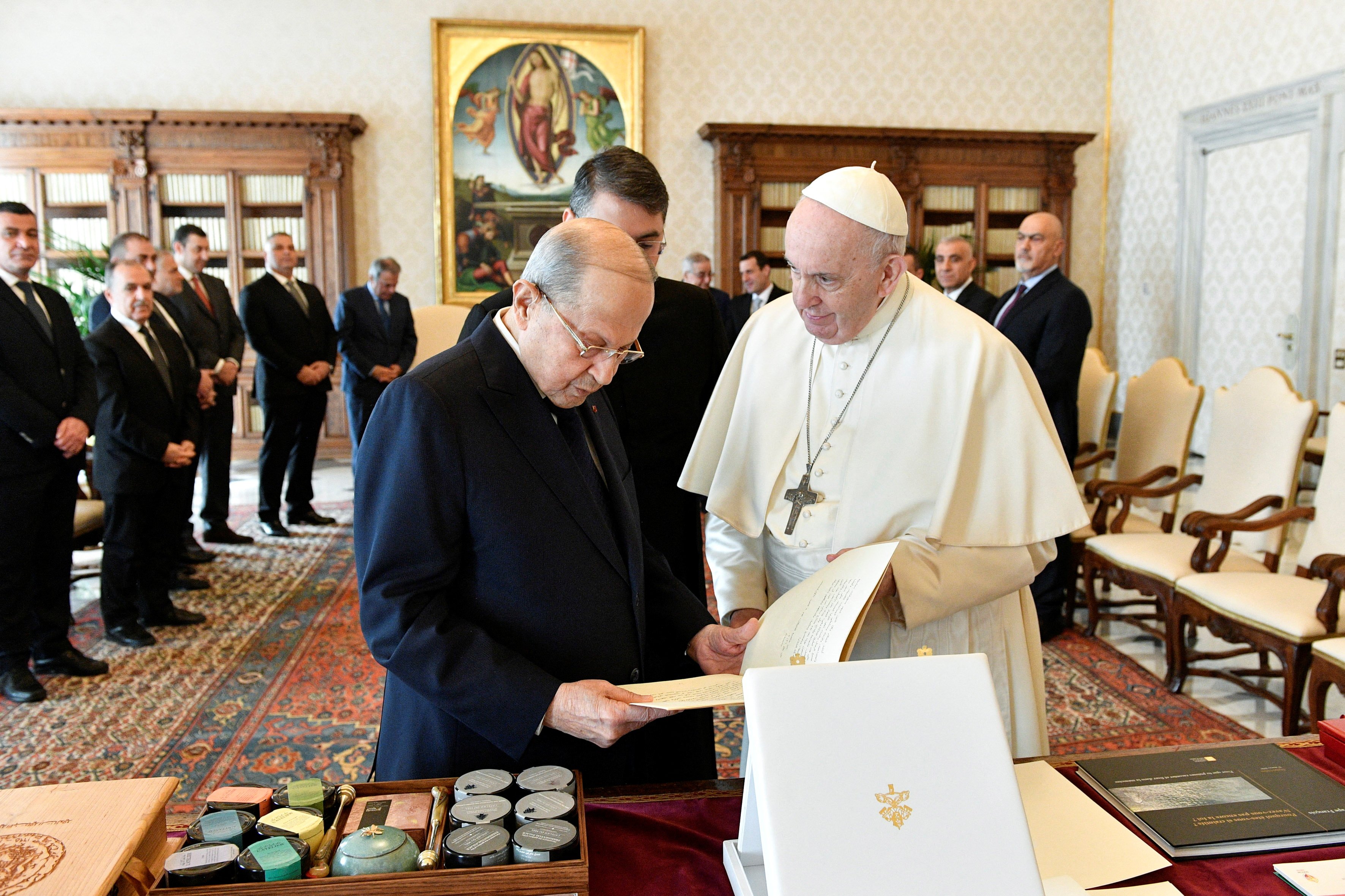 Pope Francis exchanges gifts with Lebanese President Michel Aoun during a private meeting at the Vatican March 21, 2022. (CNS photo/Vatican Media via Reuters)