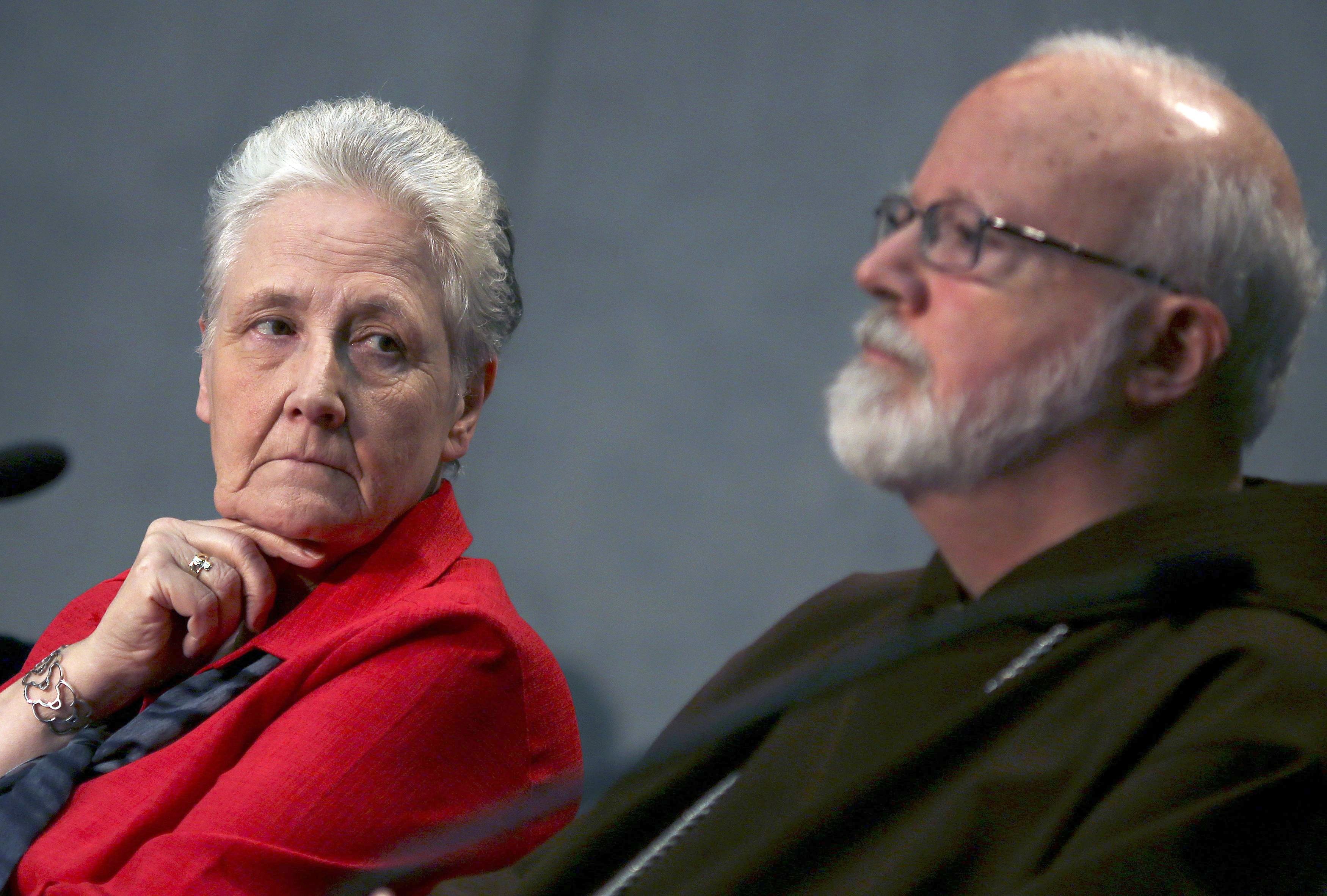 Irish abuse victim Marie Collins looks at Boston Cardinal Seán P. O'Malley during a briefing at the Holy See press office at the Vatican May 3, 2014. (CNS photo/Alessandro Bianchi, Reuters)