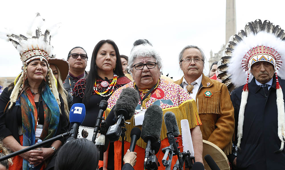 Marie-Anne Day Walker-Pelletier of Okanese First Nation speaks as Assembly of First Nations delegates meet the media outside St. Peter's Square after a meeting with Pope Francis at the Vatican March 31. (CNS/Paul Haring)