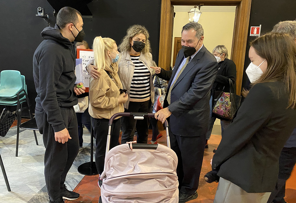 Joe Donnelly, U.S. ambassador to the Holy See, visits with Ukrainian refugees at the Community of Sant'Egidio's Refugee Welcome Center April 21 in Rome. (CNS/Courtesy of U.S. Embassy to the Holy See)