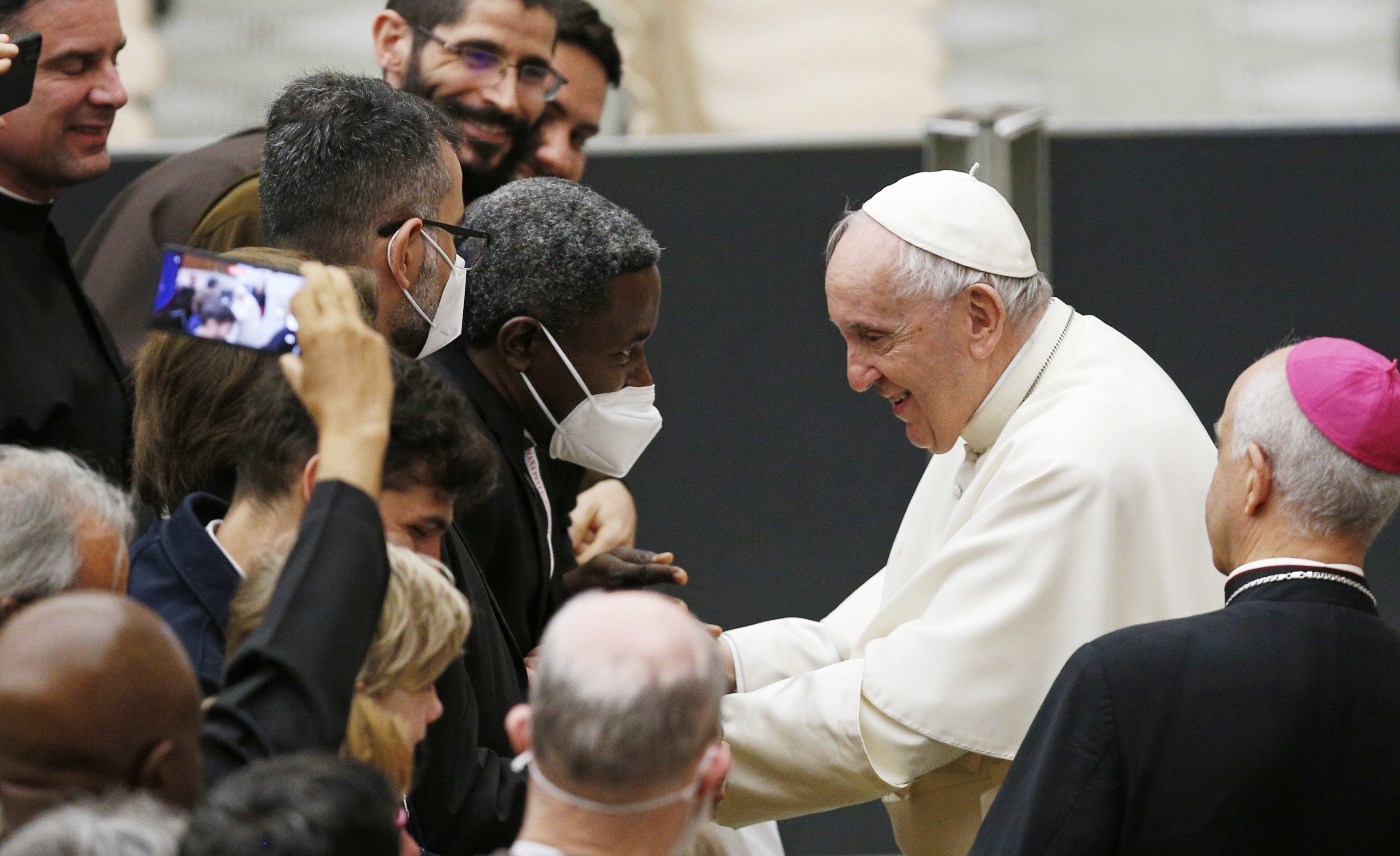 Pope Francis greets priests during an audience with Missionaries of Mercy priests at the Vatican April 25, 2022. (CNS photo/Paul Haring)