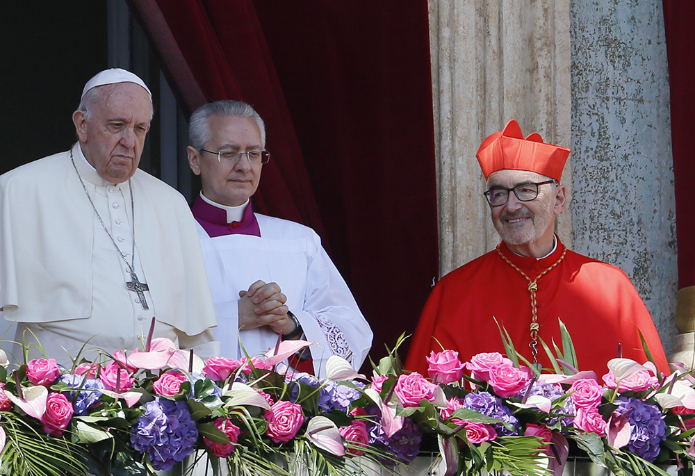 Cardinal Michael Czerny looks on as Pope Francis delivers his Easter message and blessing "urbi et orbi" (to the city and the world) from the central balcony of St. Peter's Basilica at the Vatican April 17. (CNS/Paul Haring) Cardinal Michael Czerny looks on as Pope Francis delivers his Easter message and blessing "urbi et orbi" (to the city and the world) from the central balcony of St. Peter's Basilica at the Vatican April 17. (CNS/Paul Haring)