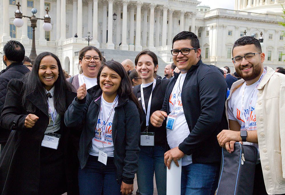 Kimberly Garcia, Guadalupe Saez, Janet Chávez España, Karla Miranda, Alejandro González and Marvin Molina from the Diocese of Arlington, Virginia, pose for a photo near the U.S. Capitol in Washington April 27 during the Raíces y Alas advocacy day.