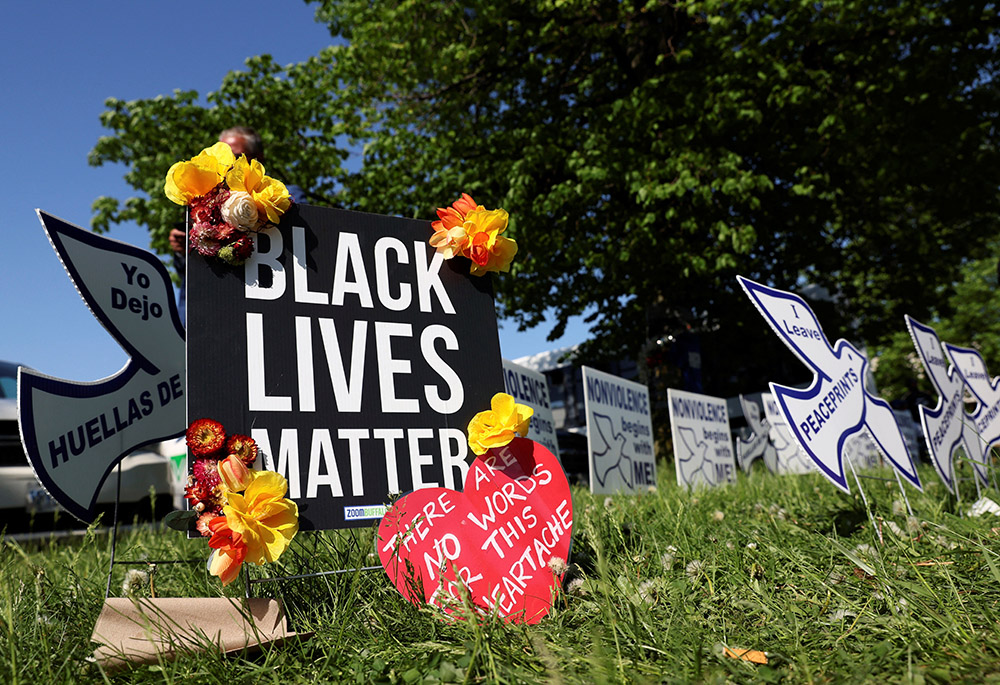 A memorial near a TOPS supermarket in Buffalo, New York, is seen May 15. Authorities say the mass shooting the day before that left 10 people dead was racially motivated. (CNS/Reuters/Brendan McDermid)