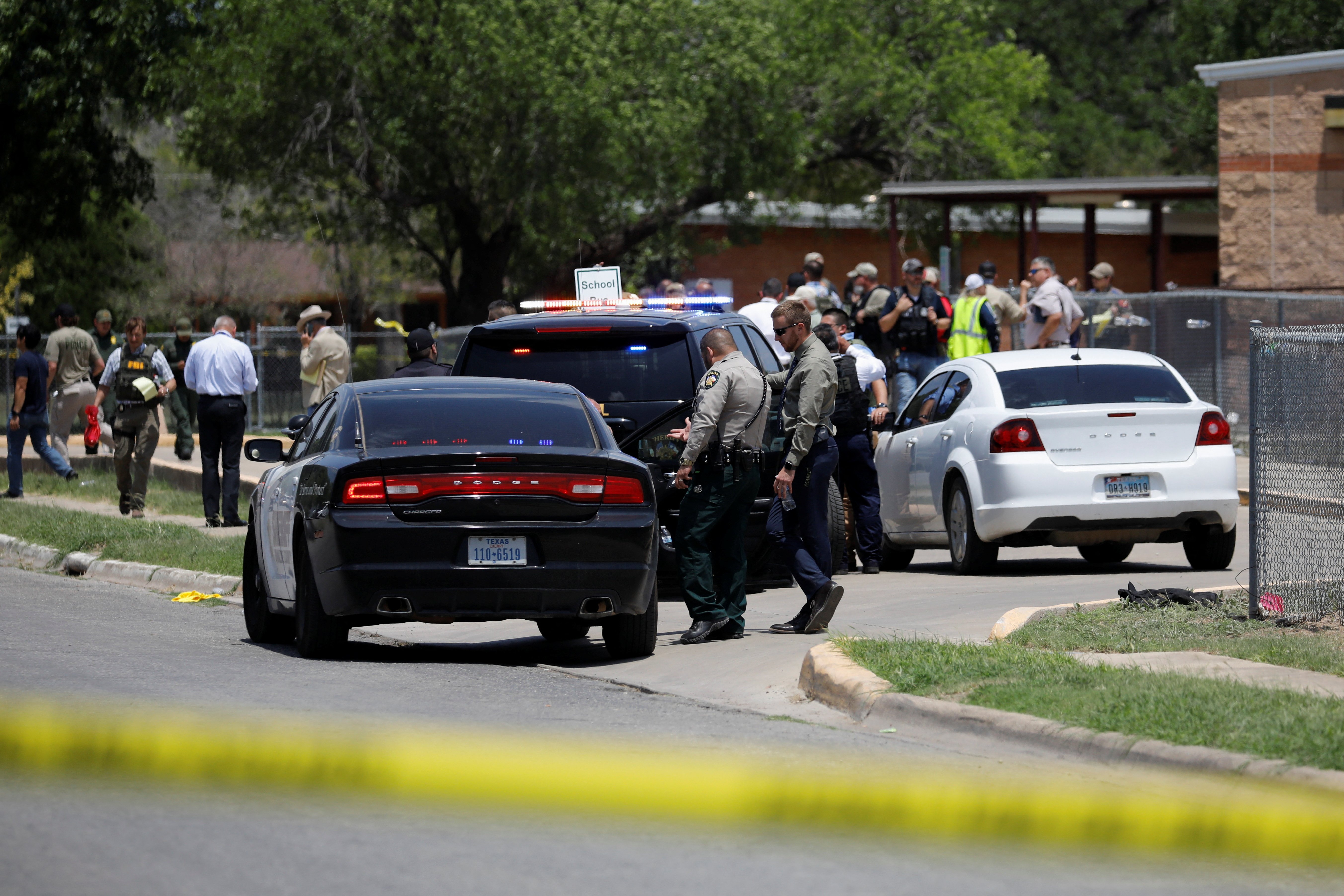 Law enforcement officers guard the scene of a shooting at Robb Elementary School in Uvalde, Texas, May 24. (CNS/Reuters/Marco Bello)