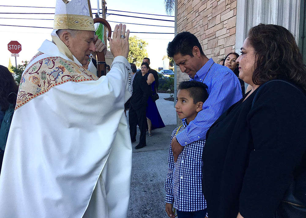 Bishop Robert McElroy of San Diego blesses the faithful following a Mass at St. Anthony Church Nov. 2, 2019. (CNS/San Diego Diocese/Aida Bustos)