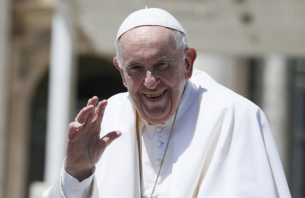 Pope Francis waves as he leaves his general audience in St. Peter's Square at the Vatican June 8. (CNS/Paul Haring)