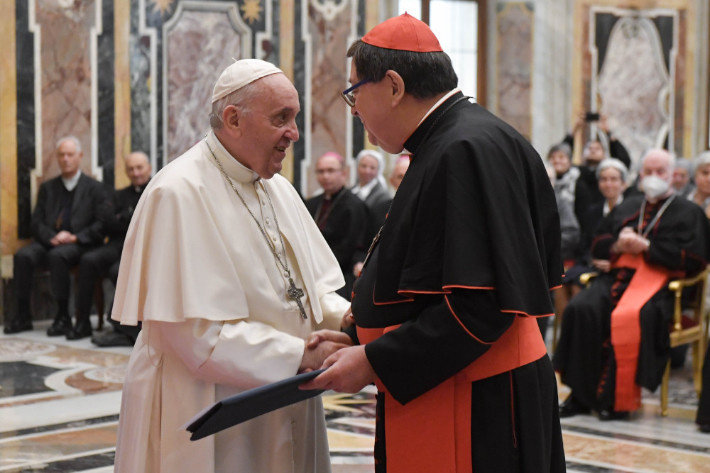 Pope Francis greets Brazilian Cardinal João Braz de Aviz, prefect of the then-Congregation for Institutes of Consecrated Life and Societies of Apostolic Life, during an audience at the Vatican Dec. 11, 2021. (CNS/Vatican Media)