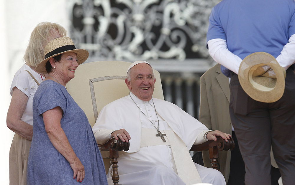 Pope Francis greets people during his general audience in St. Peter's Square at the Vatican June 22. (CNS/Paul Haring)