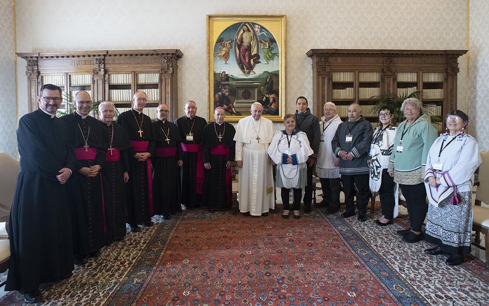 Pope Francis is pictured with Canadian Indigenous delegates from the Métis National Council and bishops representing the Canadian bishops' conference during a meeting at the Vatican March 28. (CNS/Vatican Media)