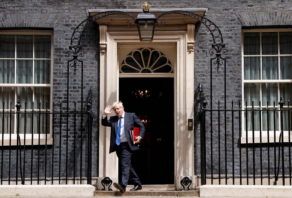 British Prime Minister Boris Johnson walks at Downing Street in London July 6. The following day, he resigned as prime minister. (CNS/Reuters/John Sibley)