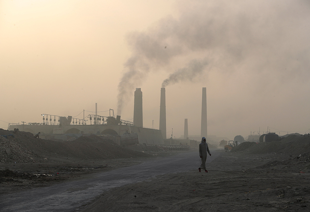 A general view shows brick factories as smoke rises from the stacks in the town of Nahrawan June 5 in Baghdad, Iraq. (CNS/Reuters/Thaier al-Sudani) A general view shows brick factories as smoke rises from the stacks in the town of Nahrawan June 5 in Baghdad, Iraq. (CNS/Reuters/Thaier al-Sudani)