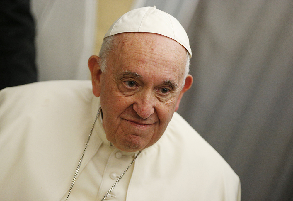 Pope Francis looks on as he answers questions from journalists aboard his flight from Iqaluit, in the Canadian territory of Nunavut, to Rome July 29. (CNS/Paul Haring)