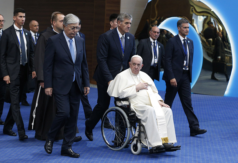 Pope Francis and Kazakh President Kassym-Jomart Tokayev, left, arrive for the conclusion of the Congress of Leaders of World and Traditional Religions at the Palace of Peace and Reconciliation Sept. 15 in Nur-Sultan, Kazakhstan. (CNS/Paul Haring) Pope Francis and Kazakh President Kassym-Jomart Tokayev, left, arrive for the conclusion of the Congress of Leaders of World and Traditional Religions at the Palace of Peace and Reconciliation Sept. 15 in Nur-Sultan, Kazakhstan. (CNS/Paul Haring)