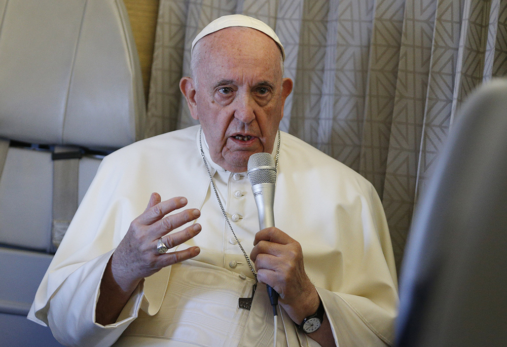 Pope Francis answers questions from journalists aboard his flight from Nur-Sultan, Kazakhstan, to Rome Sept. 15. (CNS/Paul Haring)
