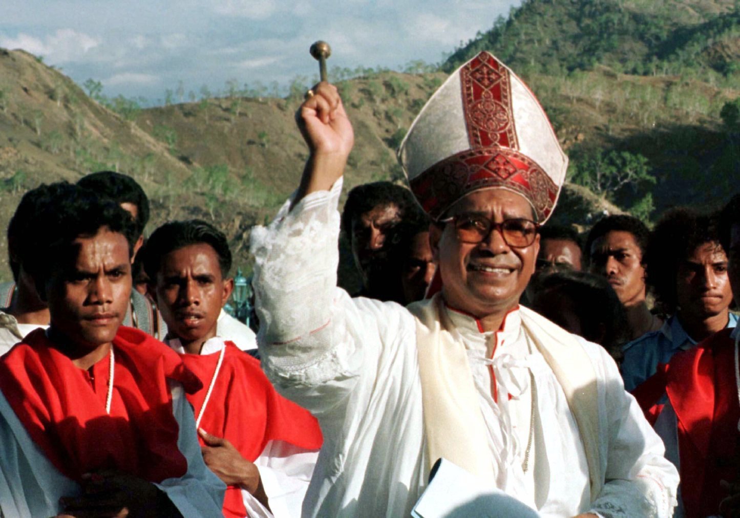 East Timorese Bishop Carlos Filipe Ximenes Belo sprinkles holy water during an outdoor Mass in Dili in this file photo. The bishop, now retired, has been accused of sexual abuse of minors. (CNS/Reuters)
