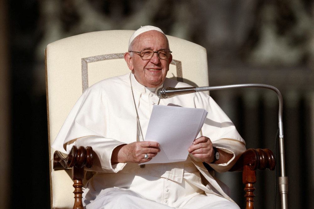 Pope Francis smiles during his general audience in St. Peter's Square at the Vatican Oct. 12, 2022