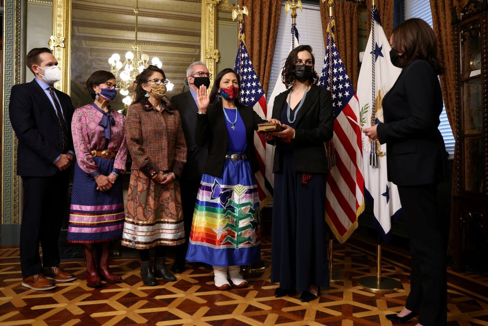 Debra Haaland, an enrolled citizen of the Laguna Pueblo tribe is sworn in as U.S. secretary of the Interior Department by Vice President Kamala Harris March 18, 2021. 
