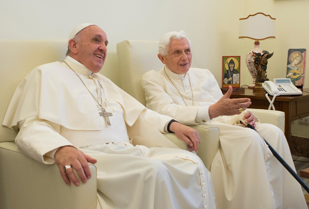 Pope Francis chats with retired Pope Benedict XVI at the retired pope's home at the Mater Ecclesiae monastery at the Vatican June 30, 2015. Earlier that month, Francis had issued "Laudato Si', on Care for Our Common Home," his encyclical focused on ecology and faith. (CNS/L'Osservatore Romano)