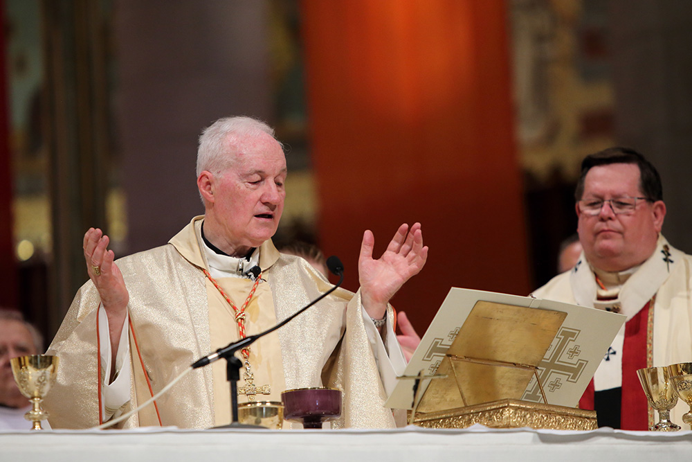 Cardinal Marc Ouellet, left, and Quebec Cardinal Gérald Lacroix concelebrate Mass in 2018 at the Basilica of Ste.-Anne-de-Beaupré in Ste.-Anne-de-Beaupré, Quebec. (CNS/Présence/Philippe Vaillancourt)
