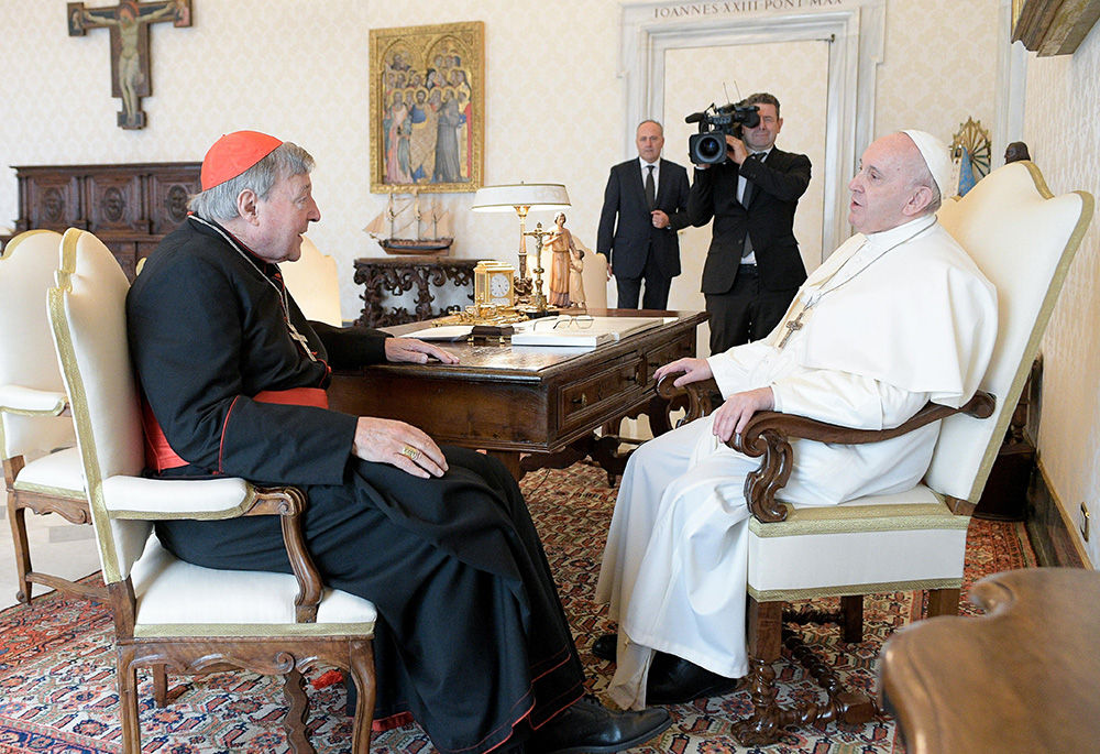 Pope Francis talks with Australian Cardinal George Pell during an audience Oct. 12, 2020, at the Vatican. Pell died Jan. 10 at age 81. (CNS/Vatican Media)