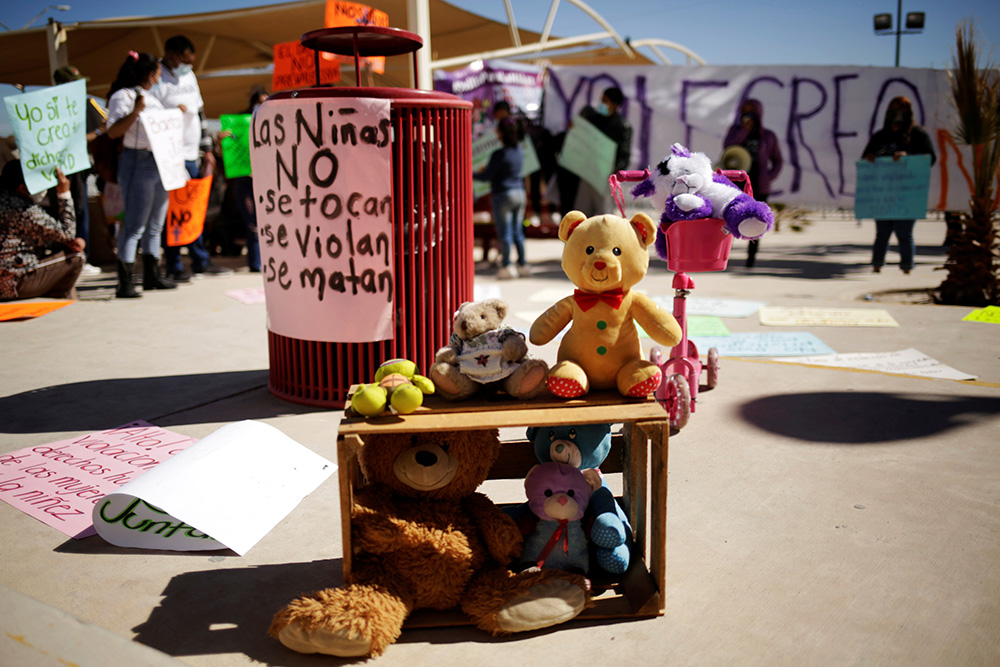 Children's toys are seen during a protest to demand justice against a Catholic priest accused of sexually abusing a minor, outside the courts in Ciudad Juárez, Mexico, Feb. 22, 2021. (CNS/Reuters/Jose Luis Gonzalez)