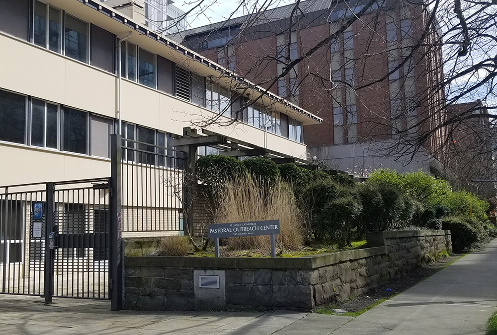 The St. James Cathedral Pastoral Outreach Center and the Paul Pigott Building, seen in the background, are among four properties the Archdiocese of Seattle and St. James Cathedral are selling to Westbank. The Vancouver, British Columbia, developer plans to create a carbon-neutral residential community in Seattle's First Hill neighborhood. Seattle Archbishop Paul Etienne announced the property sale and development plans March 29, 2022. (CNS/Northwest Catholic/Jean Parietti)