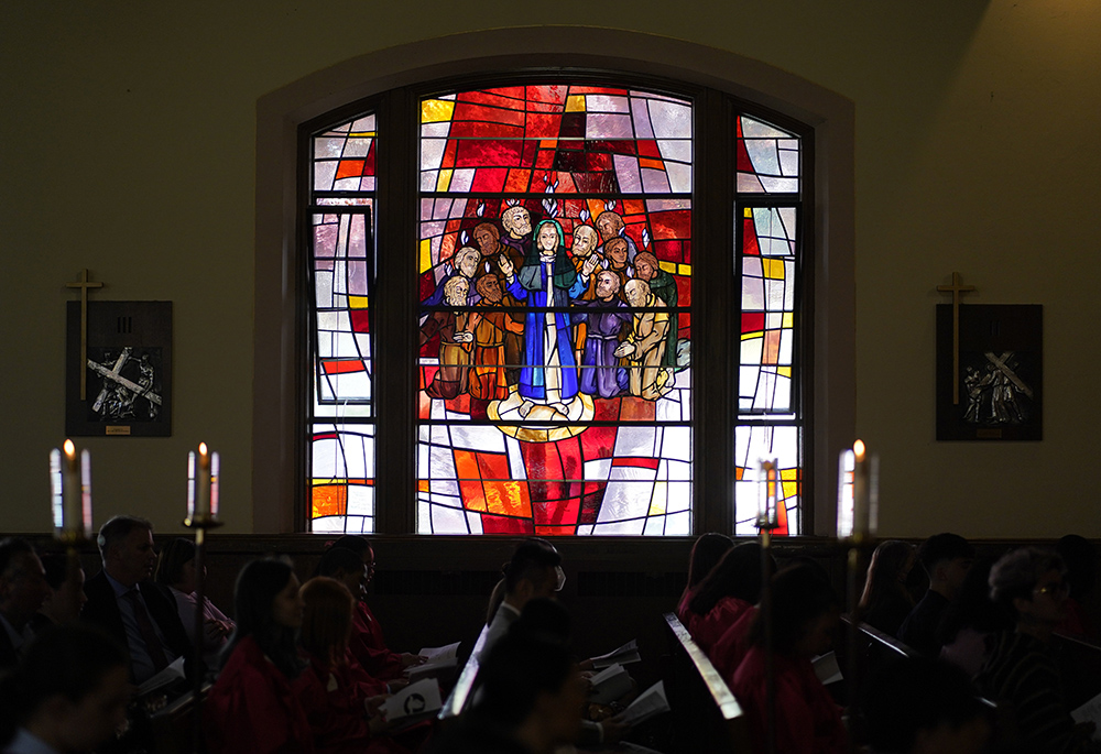 A stained-glass window depicting the descent of the Holy Spirit upon Mary and the apostles is seen during a confirmation Mass May 5, 2022, at Holy Family Church in Queens, New York. (CNS/Gregory A. Shemitz)