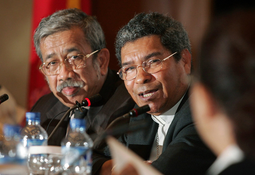 Retired East Timorese Bishop Carlos Filipe Ximenes Belo, center, speaks at a March 26, 2007, news conference in Jakarta, Indonesia. The Nobel Peace Prize winner has been accused of sexual abuse of minors. (CNS/Reuters/Dadang Tri)