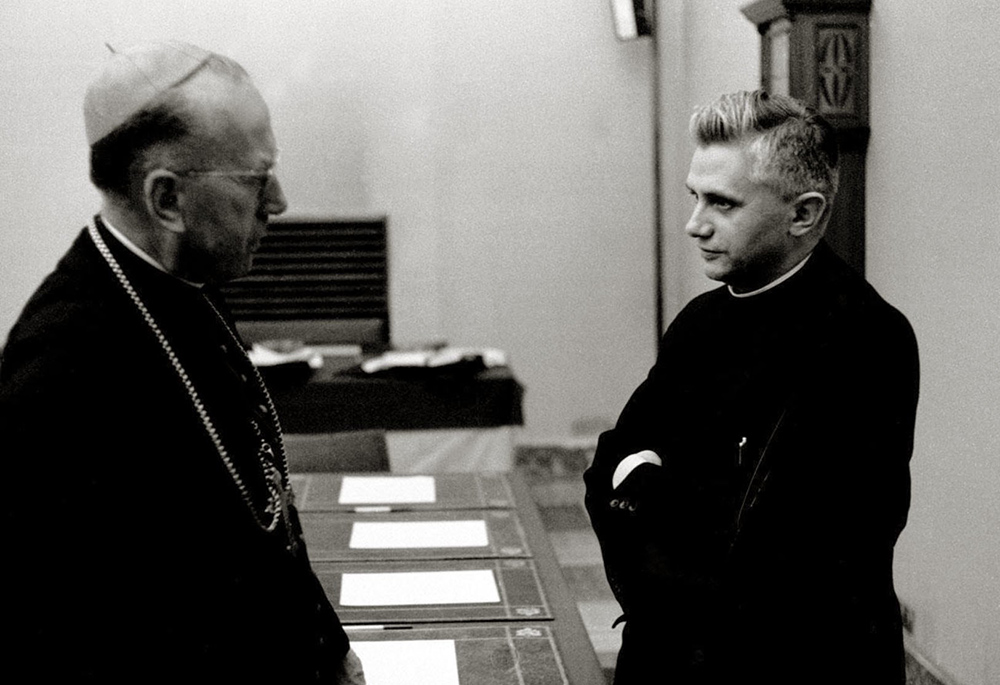 Fr. Joseph Ratzinger, the future Pope Benedict XVI, talks with Cardinal Franz Konig of Vienna during the Second Vatican Council at the Vatican in 1962. Pope Benedict died Dec. 31, 2022, at the age of 95 in his residence at the Vatican. (CNS/Courtesy of Diocese of Mainz archives, KNA)
