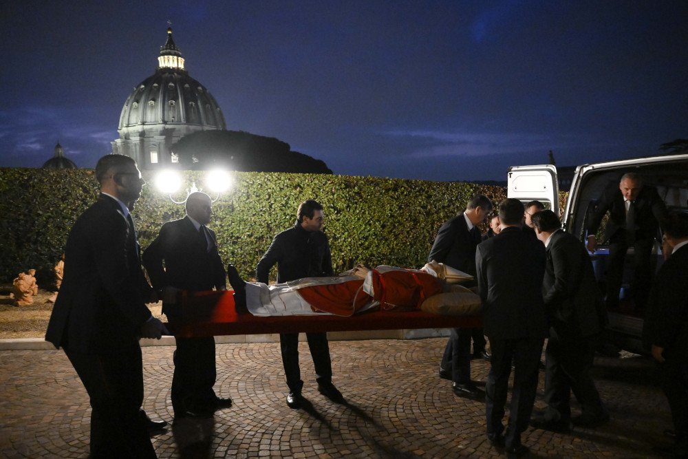 The body of the late Pope Benedict XVI is transferred to St. Peter's Basilica in the early morning at the Vatican Jan. 2, 2023. (CNS photo/Vatican Media)