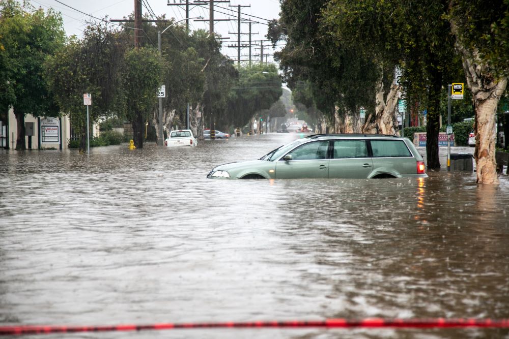 Abandoned cars are seen in a flooded street in east Santa Barbara, Calif., Jan. 9, 2023.