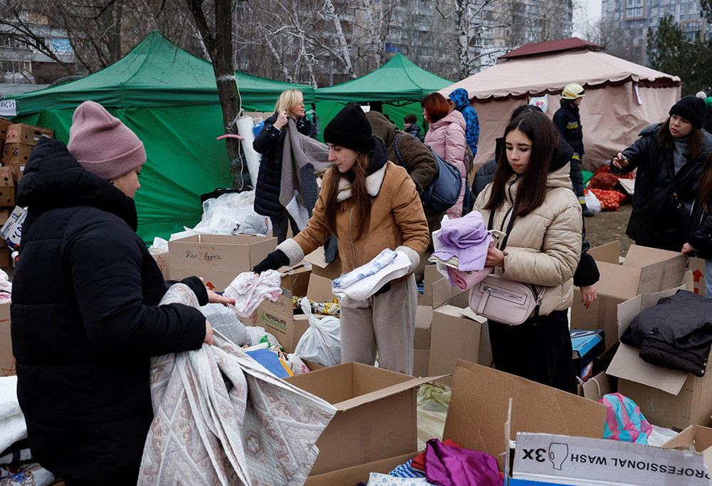 Humanitarian aid is delivered Jan. 16 after an apartment block was heavily damaged by a Russian missile strike in Dnipro, Ukraine. (OSV News/Reuters/Clodagh Kilcoyne)