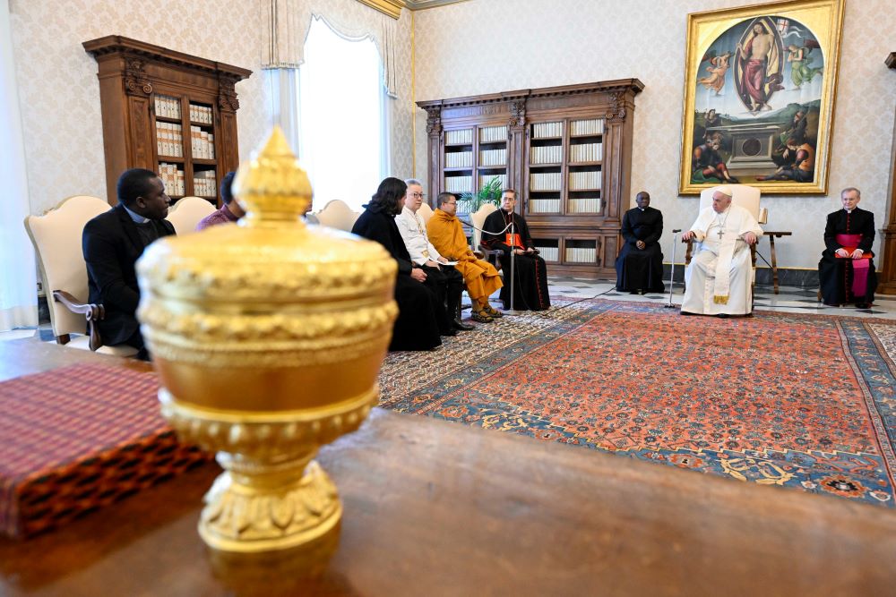 Pope Francis meets with a delegation of Buddhists from Cambodia and staff of the Dicastery for Interreligious Dialogue in the library of the Apostolic Palace at the Vatican Jan. 19, 2023. (CNS/Vatican Media)