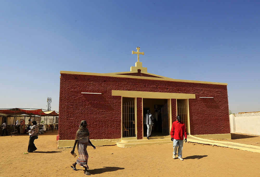 South Sudanese walk near a Catholic church in Omdurman, Sudan. (CNS/Reuters/Mohamed Nureldin Abdallah)