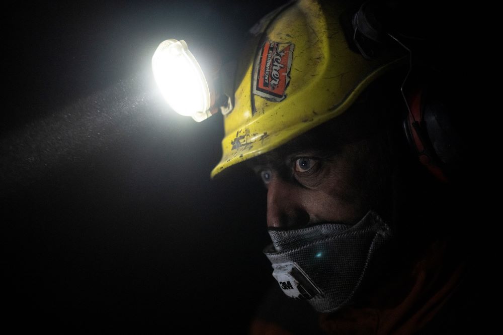 Coal miner Jonny Sandvoll works at the bottom of the Gruve 7 coal mine in Adventdalen, Norway, Monday, Jan. 9, 2023. (AP/Daniel Cole)