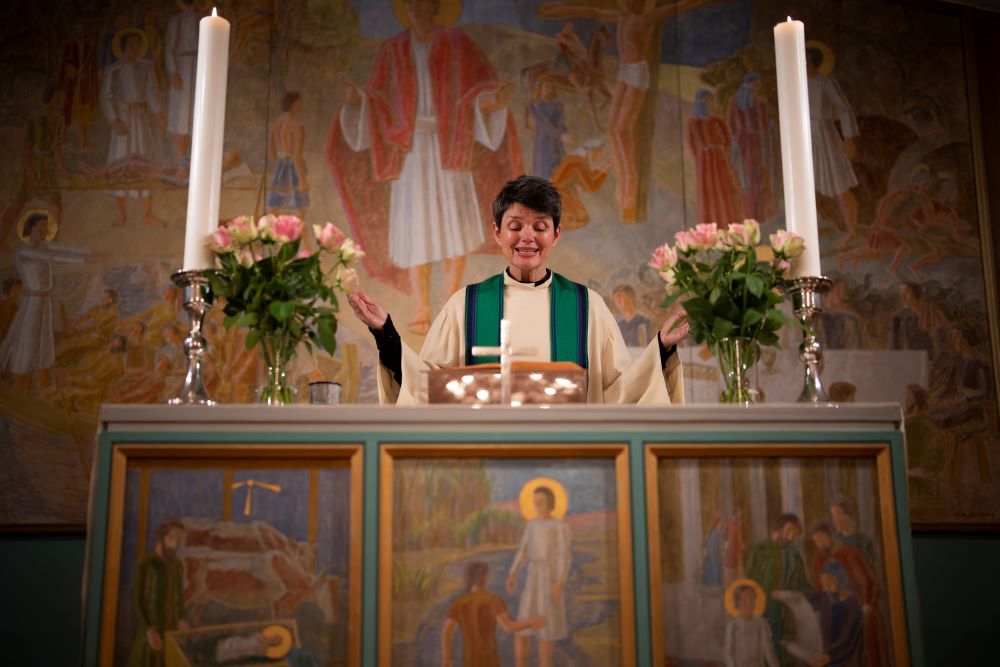 The Rev. Siv Limstrand celebrates evening service with congregants at Svalbard Kirke in Longyearbyen, Norway, Tuesday, Jan. 10, 2023. (AP/Daniel Cole)