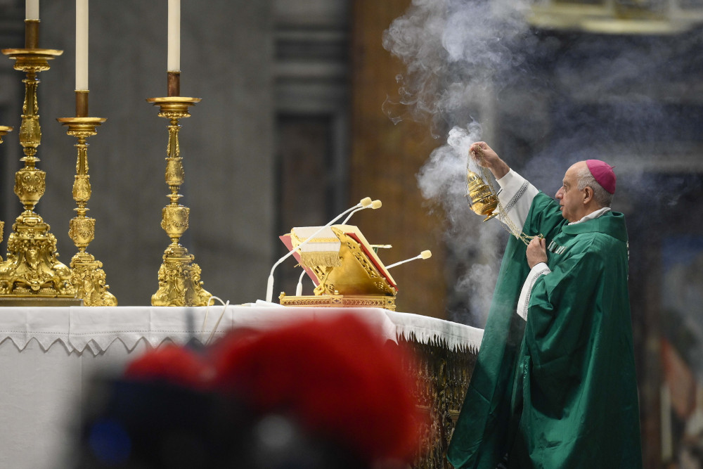 Archbishop Rino Fisichella of the Dicastery for Evangelization burns incense as Pope Francis celebrates Mass marking Sunday of the Word of God in St. Peter's Basilica at the Vatican Jan. 22. (CNS/Vatican Media)