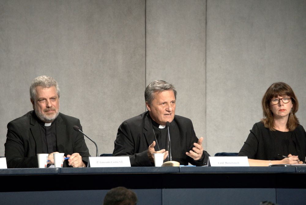 Cardinal Mario Grech, center, secretary-general of the Synod of Bishops, speaks at a news conference at the Vatican Oct. 27, 2022, to present the document for the continental phase of the Synod on Synodality. Also pictured are Italian Jesuit Father Giacomo Costa, adviser to the secretary-general of the synod, and Anna Rowlands, professor of Catholic social thought and practice at Durham University in the United Kingdom. (CNS/Junno Arocho Esteves)