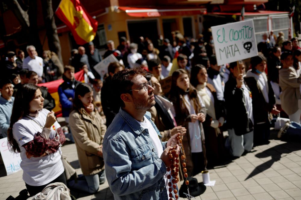 Pro-life supporters join in a prayer vigil near a private abortion clinic in Madrid April 2, 2022. The Spanish bishops' conference has criticized a new law that allows girls 16 or older to obtain abortions without parental knowledge.
