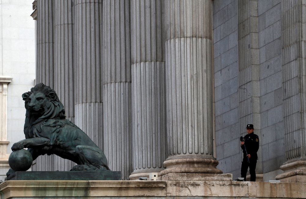A police officer stands guard outside Spanish parliament in Madrid May 21, 2019.