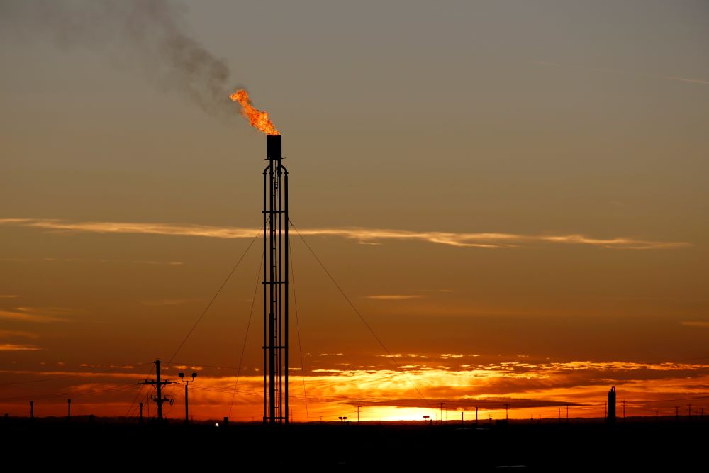 A flare burns excess natural gas in the Permian Basin in Loving County, Texas, in this Nov. 23, 2019, file photo. (CNS/Reuters/Angus Mordant)