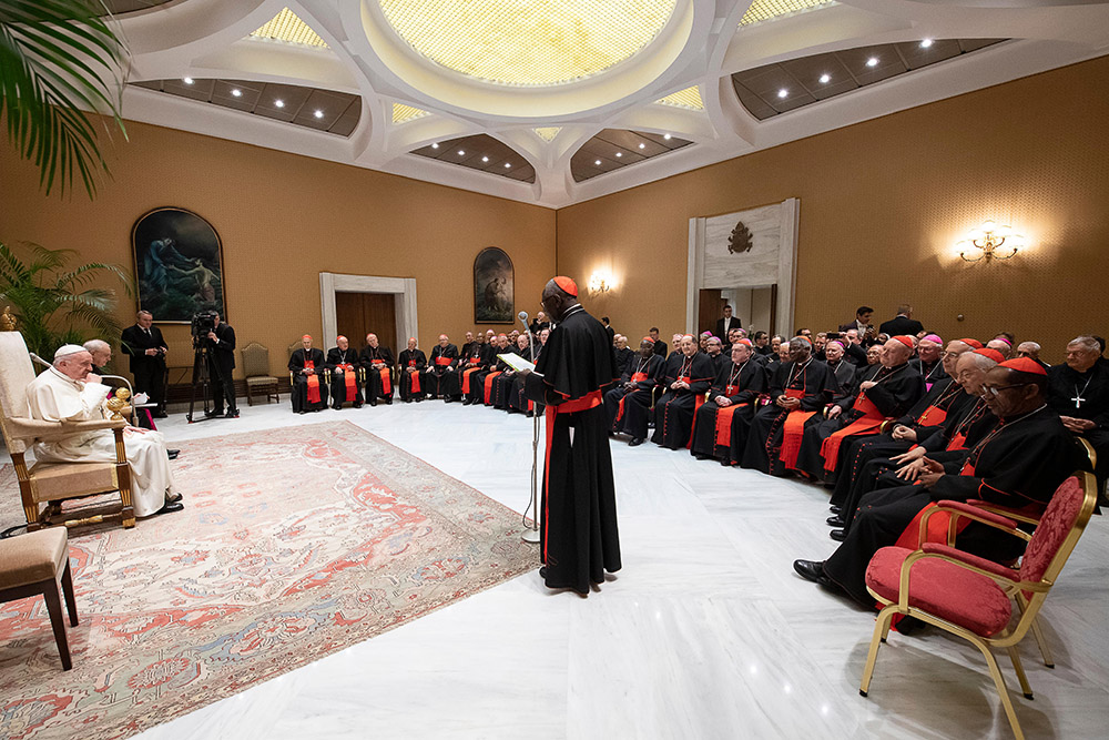 Cardinal Robert Sarah, then prefect of the Congregation for Divine Worship and the Sacraments, speaks to Pope Francis during an audience with congregation members, who were holding their plenary assembly at the Vatican Feb. 14, 2019. (CNS/Vatican Media)