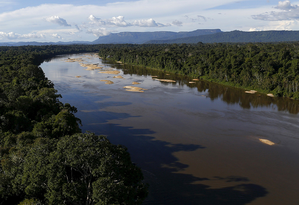 The Uraricoera River is pictured in a file photo during a Brazilian government operation against illegal gold mining on Indigenous land in the heart of the Amazon rainforest. (CNS/Reuters/Bruno Kelly)