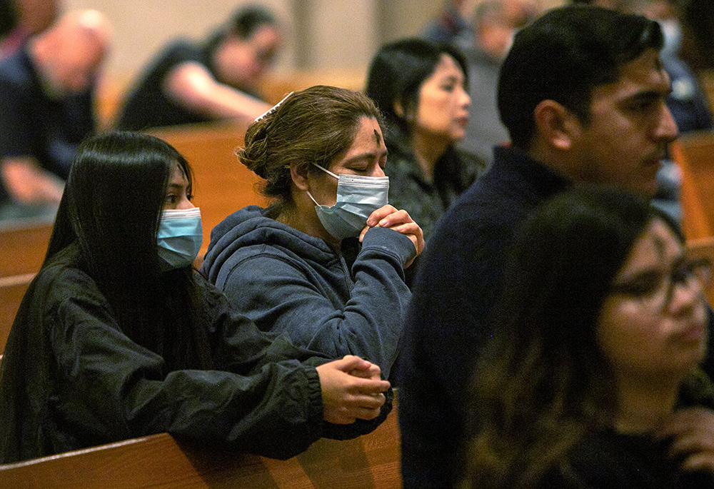 People attend Ash Wednesday Mass at the Co-Cathedral of the Sacred Heart March 2, 2022, in Houston. (CNS/Texas Catholic Herald/James Ramos)