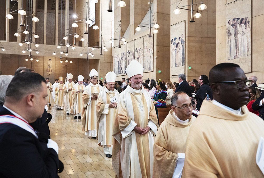 Auxiliary Bishop David O'Connell, center, processes into the Cathedral of Our Lady of the Angels with other bishops and priests from around Southern California during the annual Mass in Recognition of All Immigrants Sept. 18, 2022, in Los Angeles. (CNS/Angelus News/Victor Alemán)